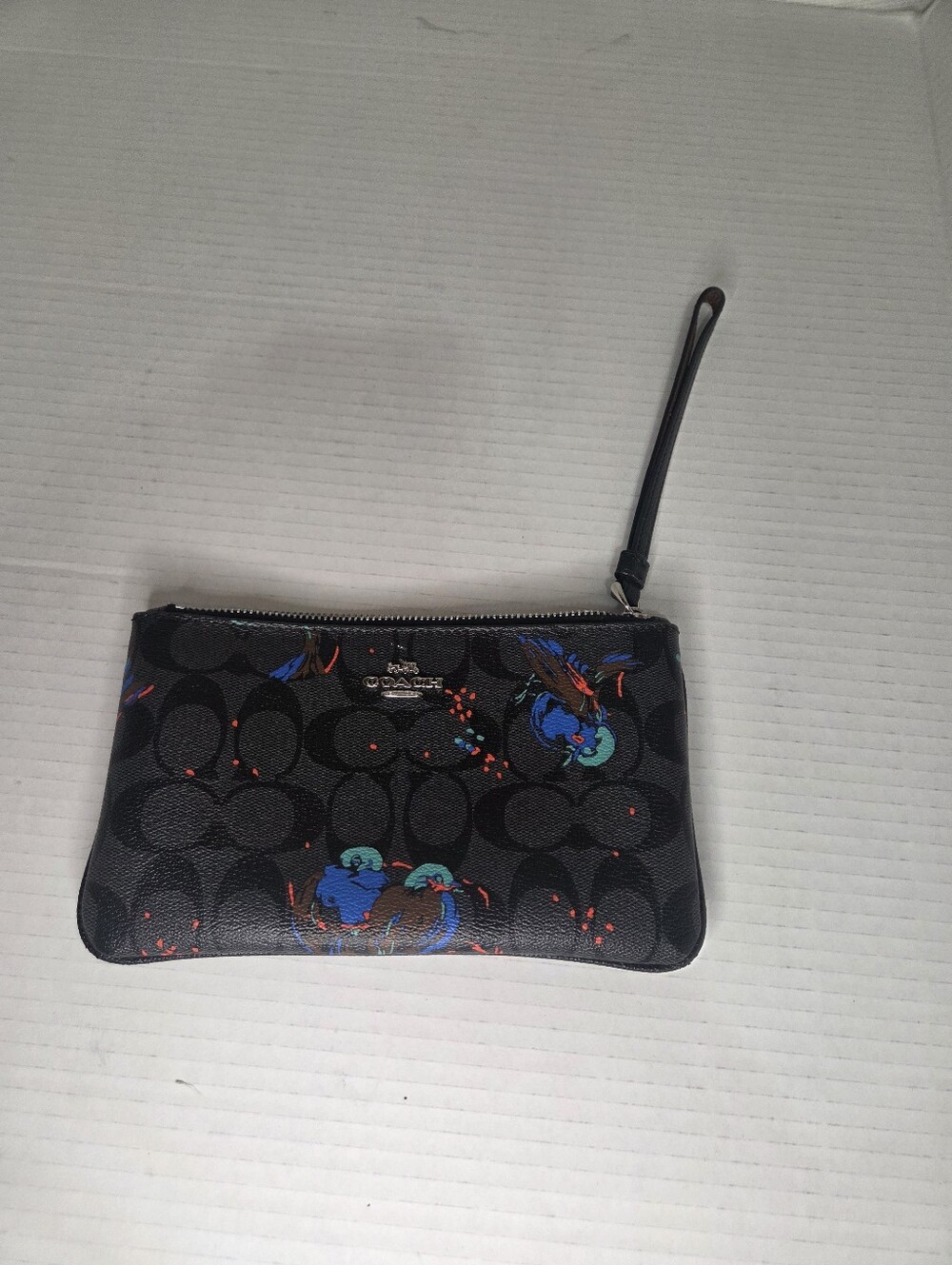 COACH F23610 SILVER/BLACK-SMOKE LARGE WRISTLET WITH BIRD PRINT